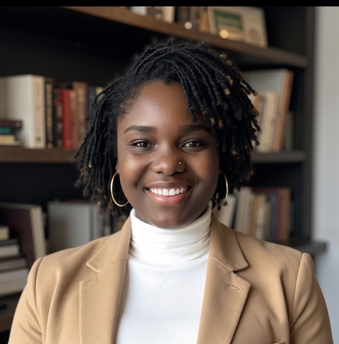 Ms. Holness, founder of H.E.A.R.T. Tutoring, wearing a tan blazer